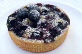Individual Blueberry Almond Tartlet with sweet shortbread crust tartlet with a blueberry and almond cream filling. (1 serving - 3" diameter)