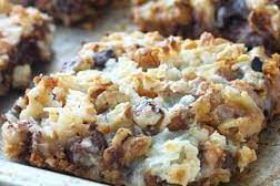 Seven Layer Bar, A true homemade style treat. Graham cracker crust, condensed milk, coconut, chocolate chips, butterscotch drops, and walnuts, all layered in for crunchy melty goodness